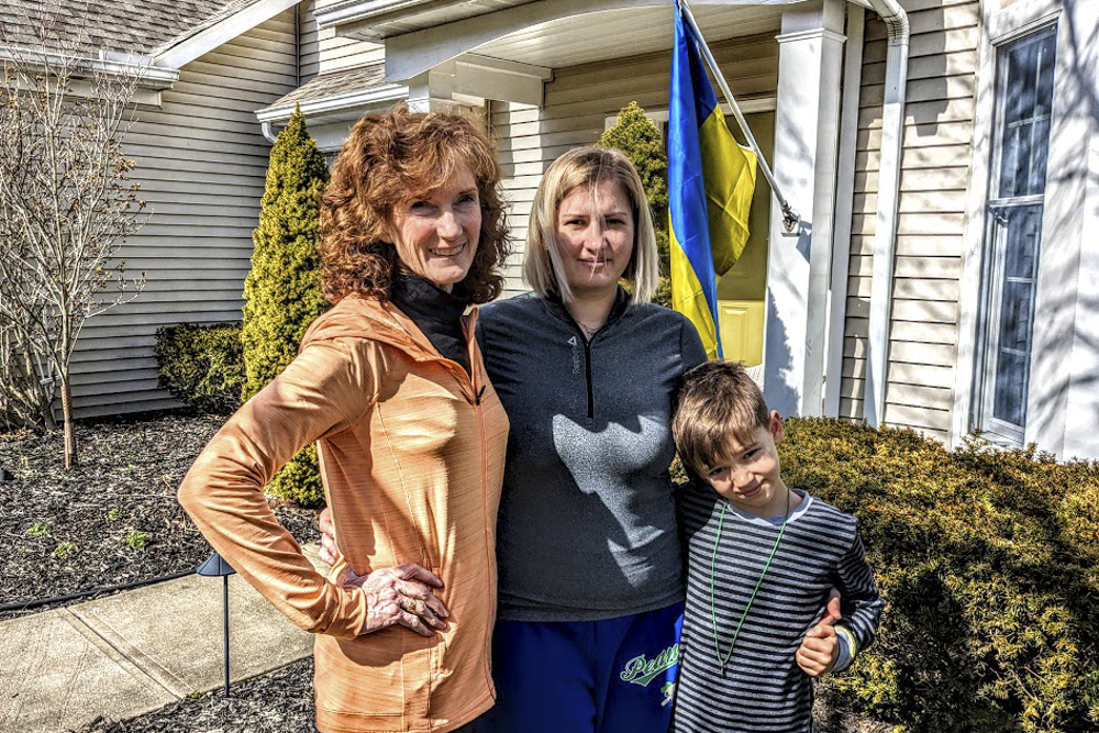 Cathy Tasse, left, is hosting a displaced Ukrainian family that includes Oleksandra and Platon Malieiev